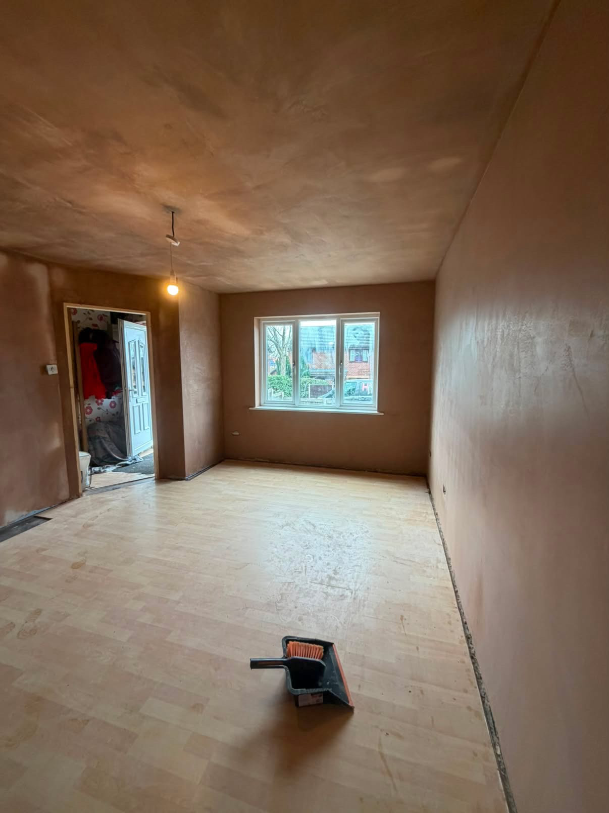 Full through-lounge re-plaster, flat and paint-ready