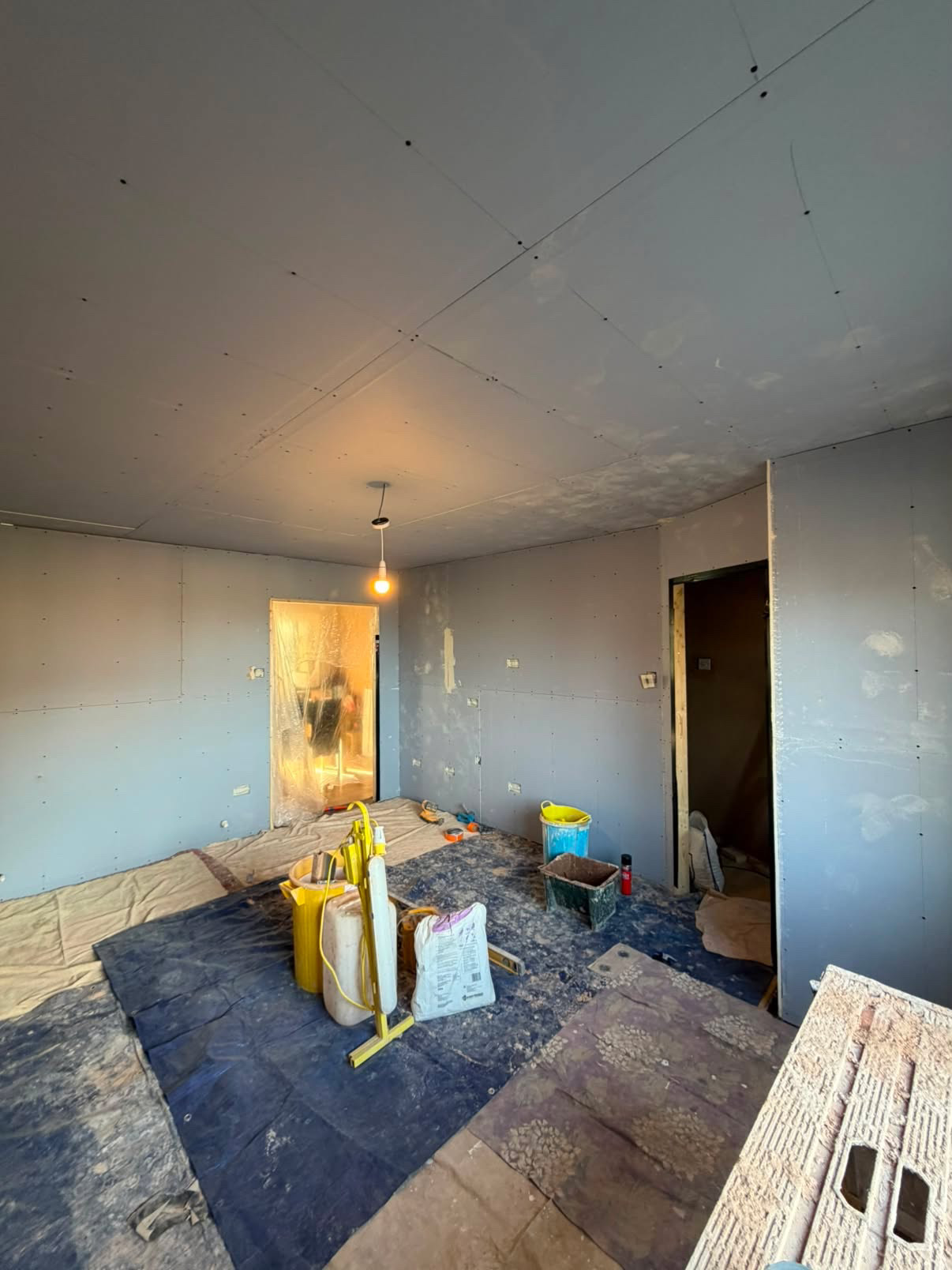 Living room boarded out and ready for the first coat