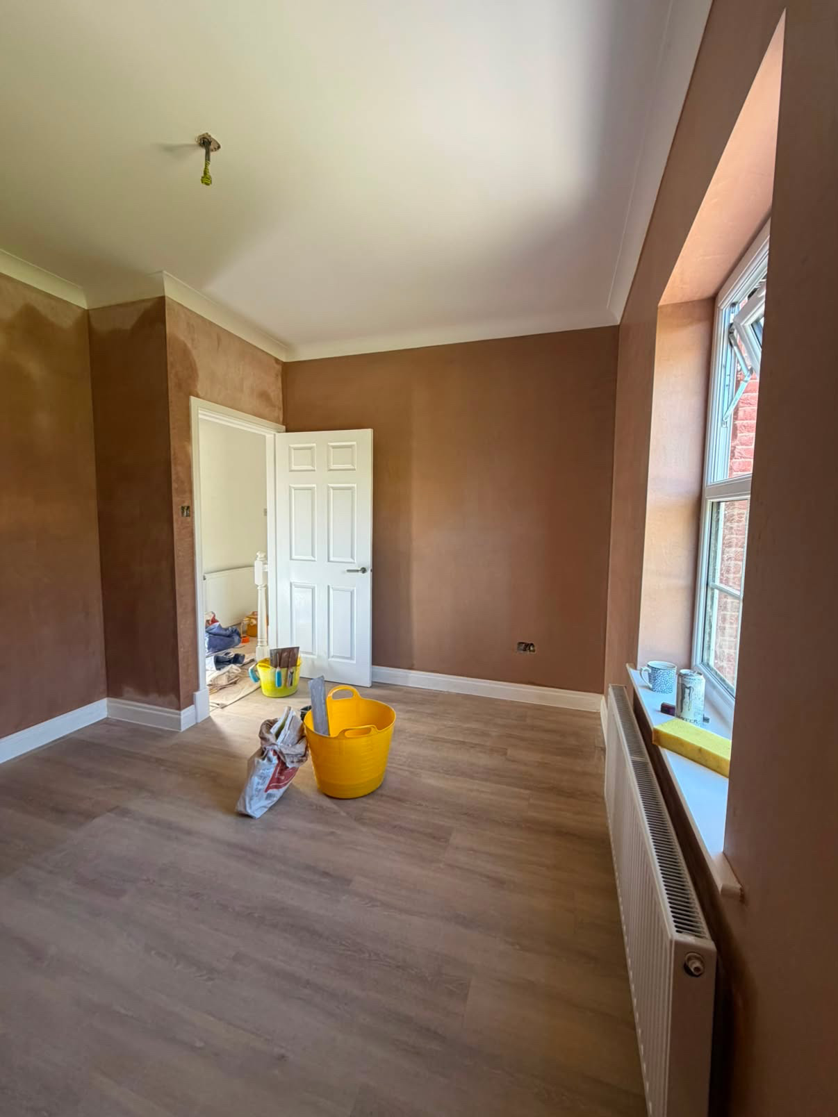 Lounge re-skimmed over existing walls with coving kept intact